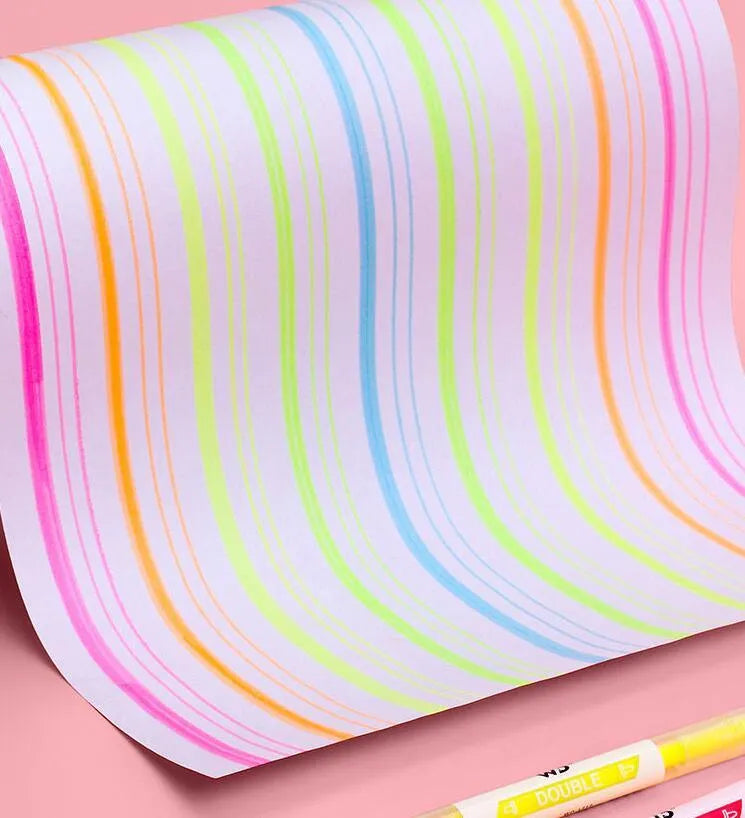 Six double-headed highlighter pens showing round and oblique nibs in orange, purple, yellow, green, blue, and pink colours
