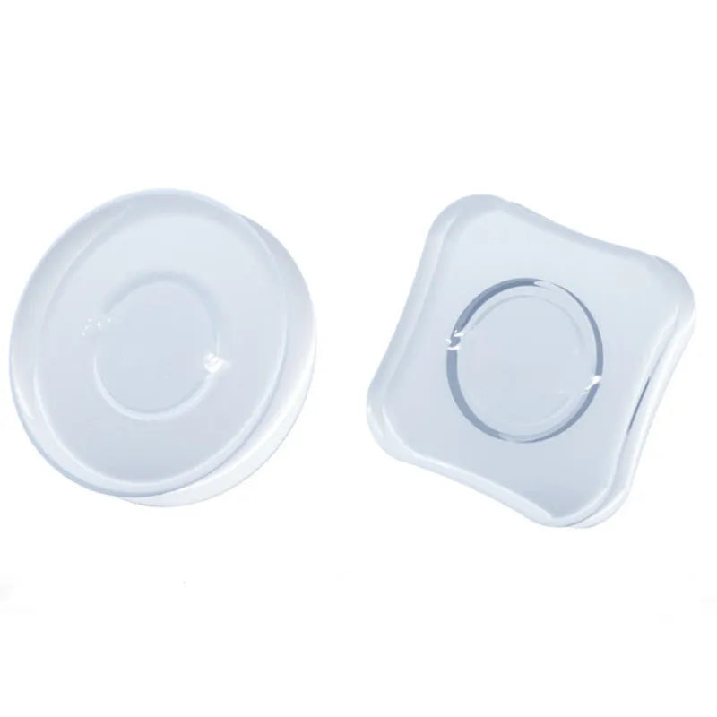 Transparent circular and square silicone nano gel adhesive pads on a smooth surface