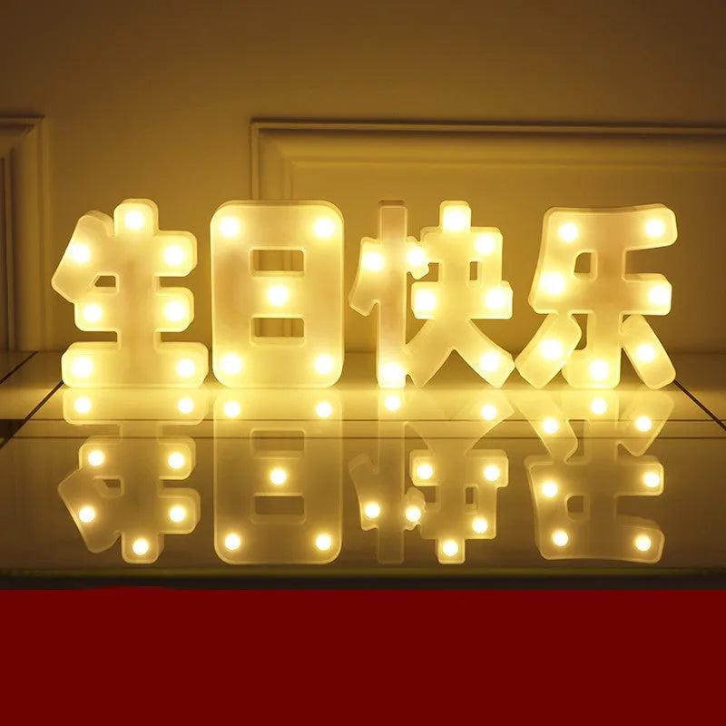 Plastic LED letter light decoration spelling a message, 22cm in height.