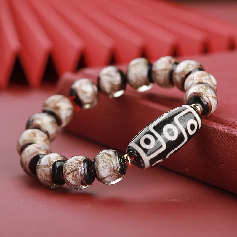 Chinese-style five-colour lucky snake bead bracelet made from coloured glaze, showing auspicious patterns.