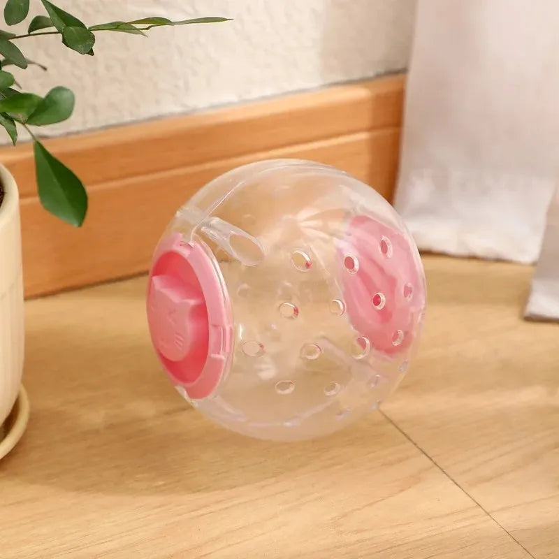 Clear blue ABS plastic slow feeder ball for cats, 11.5cm in diameter, on a wooden floor.