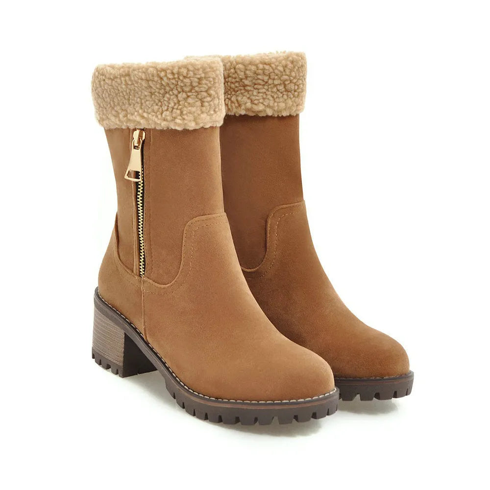 A pair of snow boots in black, grey, green, or orange with a rubber sole and plush lining.