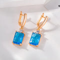 Square copper earrings with electroplated gold or silver finish and quadrilateral geometry
