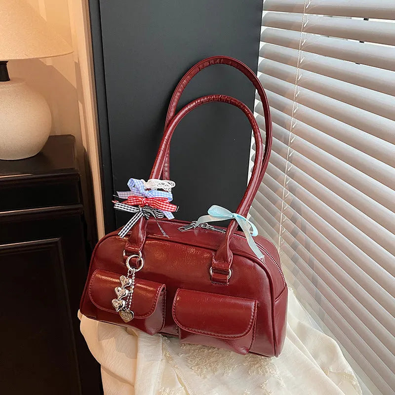 Women's black PU leather pillow shoulder bag with retro one-shoulder design and double straps