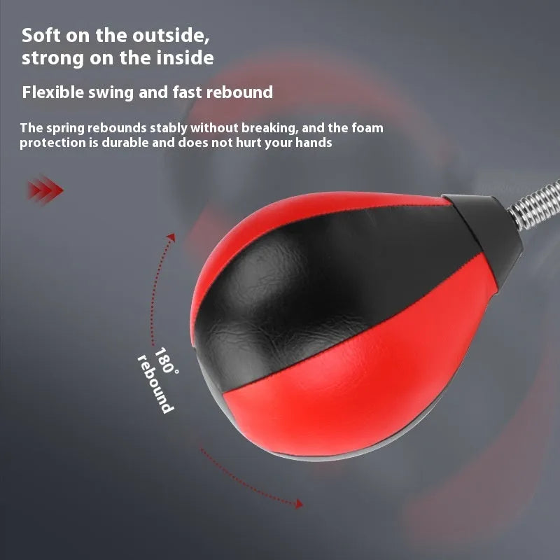 Pear-shaped hanging boxing training ball with red and black head on elastic cord and dual suction cup base.