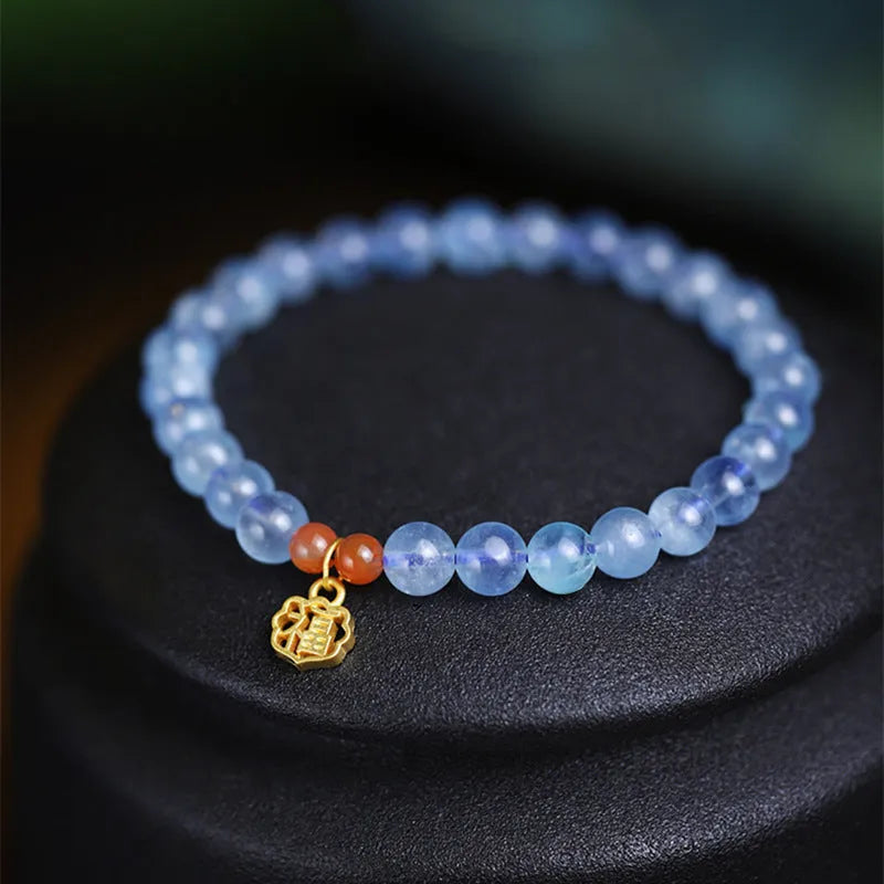 Women's ice translucent aquamarine crystal bracelet with 8mm round beads and blessing card detail