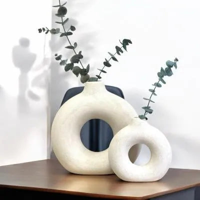Unglazed porcelain biscuit vase with frosted particle surface in neutral colour