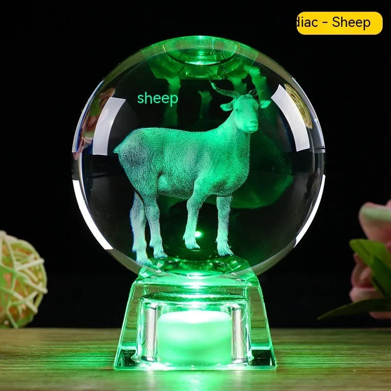White crystal ball zodiac ornament with luminous electronic base showing Chinese animal designs