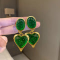 Pleated oval love heart stud earrings in purple, red, green, and yellow white colours with butterfly backs