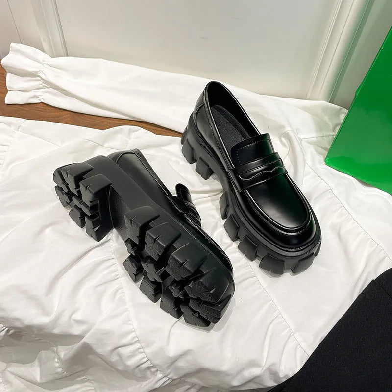 British wide-fit loafers in matte and patent leather with shallow opening and muffin heel design