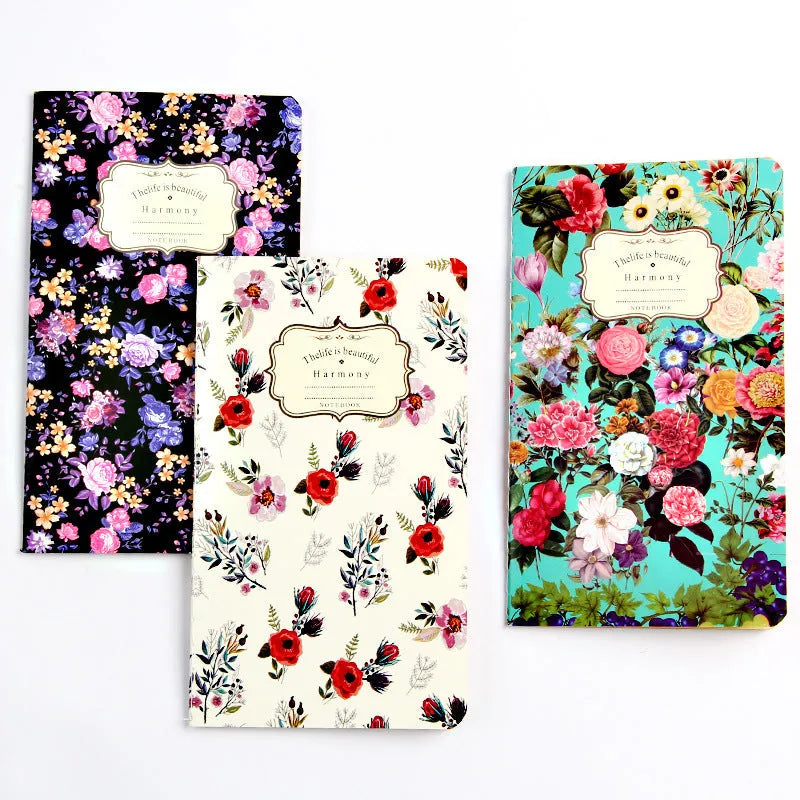 Hand-stitched kraft paper notebook with tassel bookmark on blank pages.