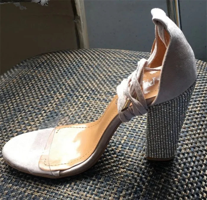Women's black and gold pointed toe high heels with plastic construction