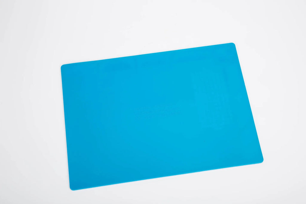 Blue silicone rubber watch repair table mat for anti-skid workspace stabilisation.