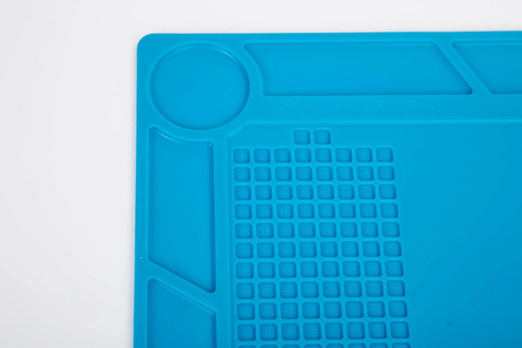 Blue silicone rubber watch repair table mat for anti-skid workspace stabilisation.