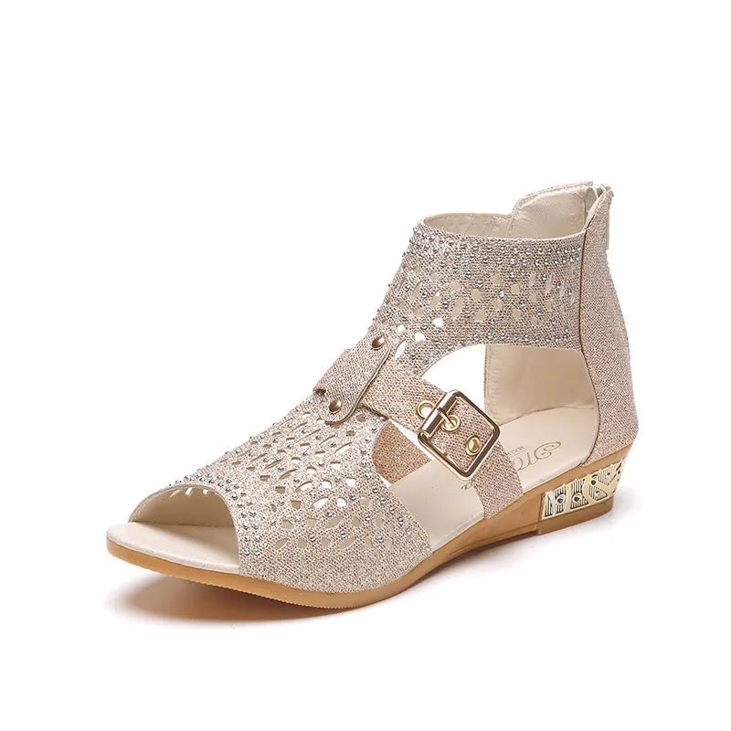 Women's beige flat sandals with a back zipper, fish mouth toe, and low wedge heel.