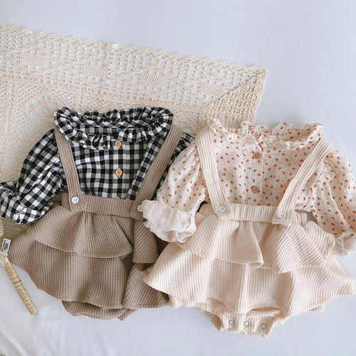 Baby girl romper with pleated lotus leaf design in cotton fabric, showing triangle climb style