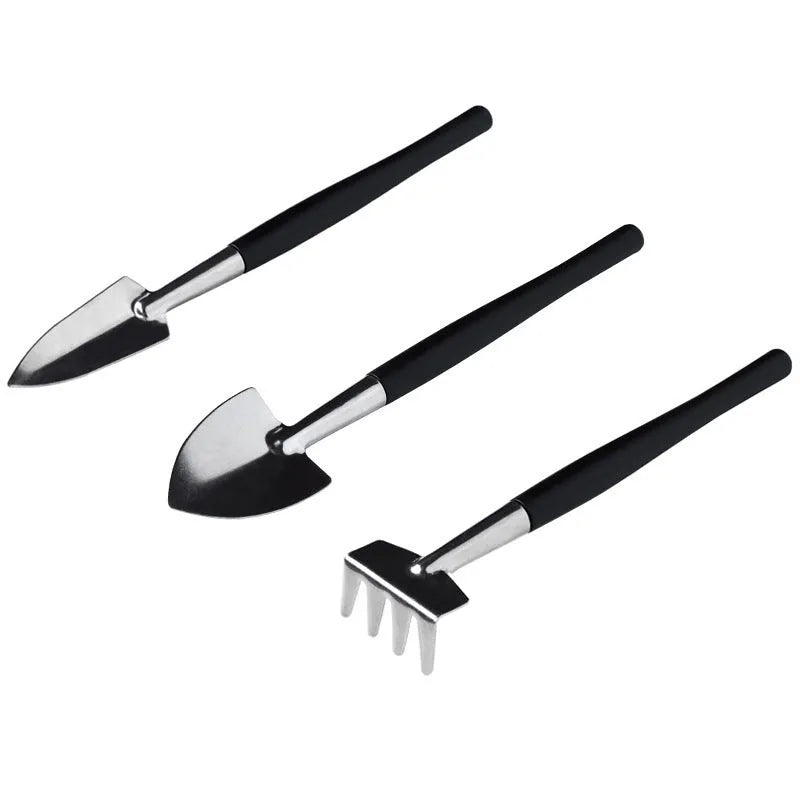 Black succulent gardening tool set with 14 pieces including tweezers, shovels, brushes, and a grey potting cushion.