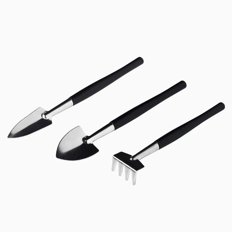 Black succulent gardening tool set with 14 pieces including tweezers, shovels, brushes, and a grey potting cushion.