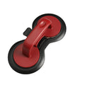 Black or red food-grade ABS burger press mould with oil paper liners on a kitchen surface.