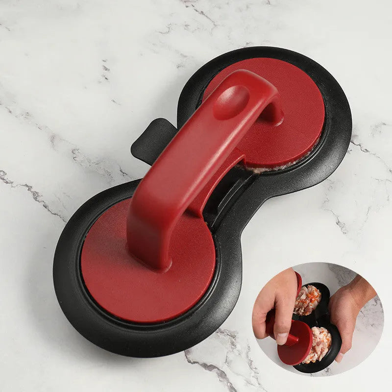 Black or red food-grade ABS burger press mould with oil paper liners on a kitchen surface.