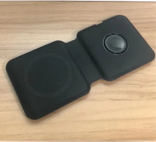 White foldable dual-pad magnetic wireless charging dock shown at an angle on a table.