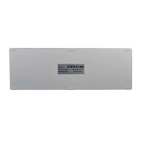 Slim white universal Bluetooth keyboard for tablets and mobile phones on a grey background