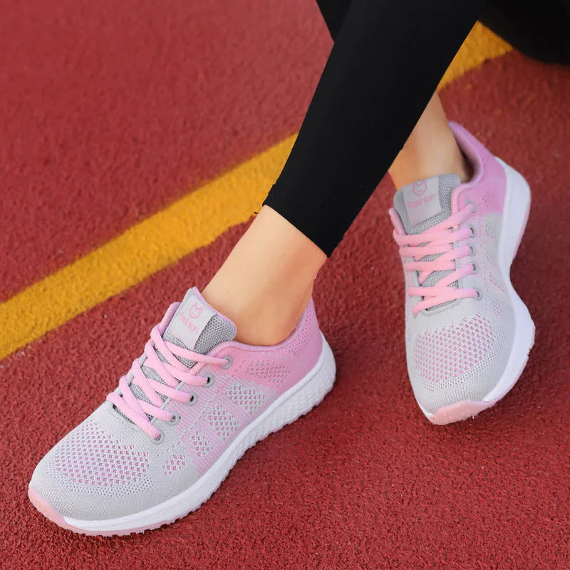 Women's white high-top flat shoes with back lacing and cross strap detail on a PU upper.