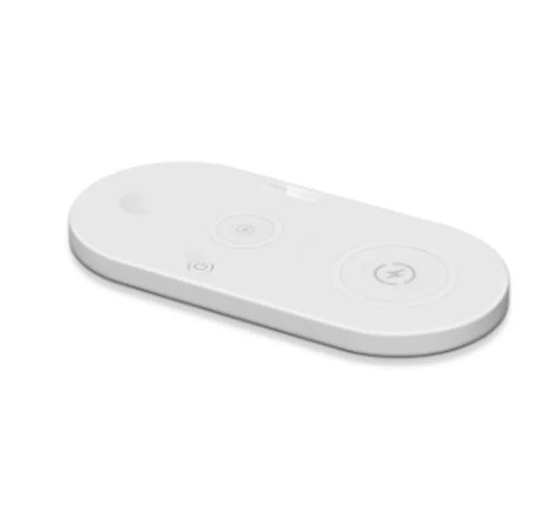 Black and white 15W fast desktop wireless charger with LED indicator on a desk