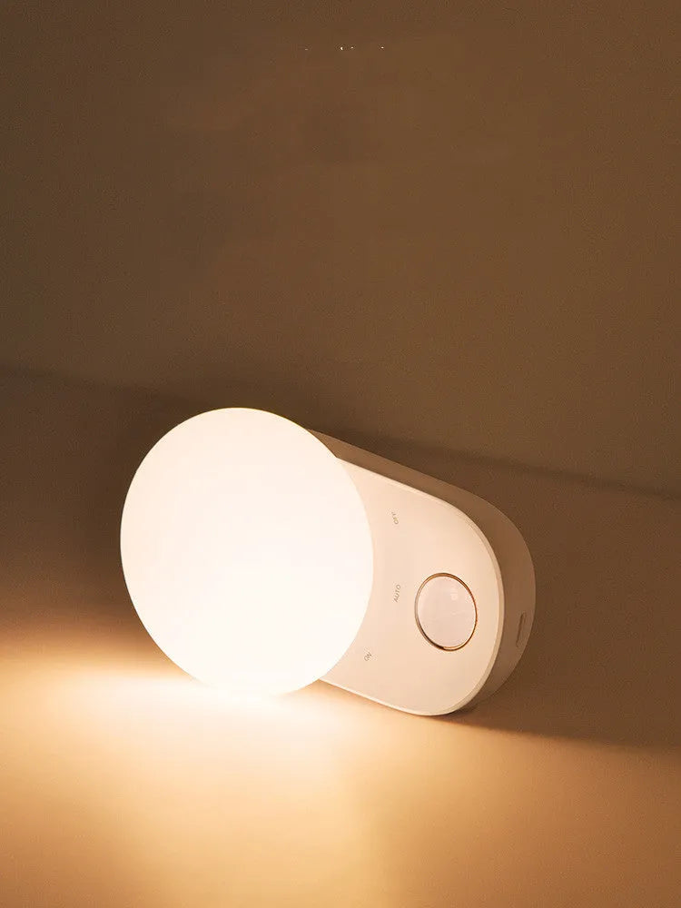 White Baseus Sunshine Series rechargeable sensor night light on a surface.