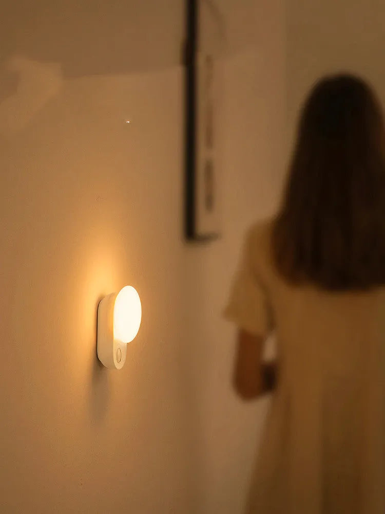 White Baseus Sunshine Series rechargeable sensor night light on a surface.