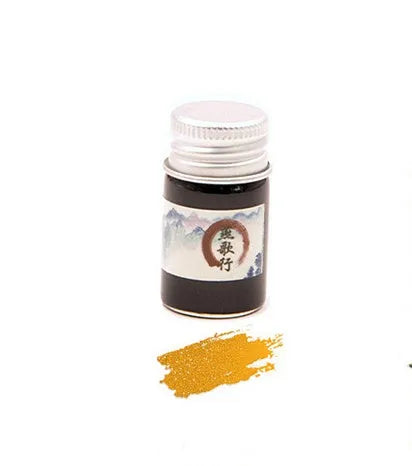 Set of six small glass bottles of pastel antiquity ink with gold powder for dipping pens.
