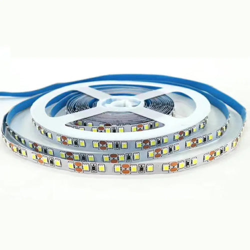 Close-up of a flexible white 2835 LED light strip with 120 LEDs per metre, coiled to show its length.