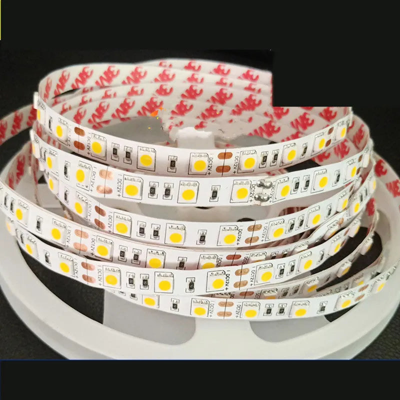 Close-up of a flexible white 2835 LED light strip with 120 LEDs per metre, coiled to show its length.