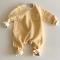 Striped baby jumpsuit with long sleeves and hidden buttons in yellow or black fleece-lined fabric