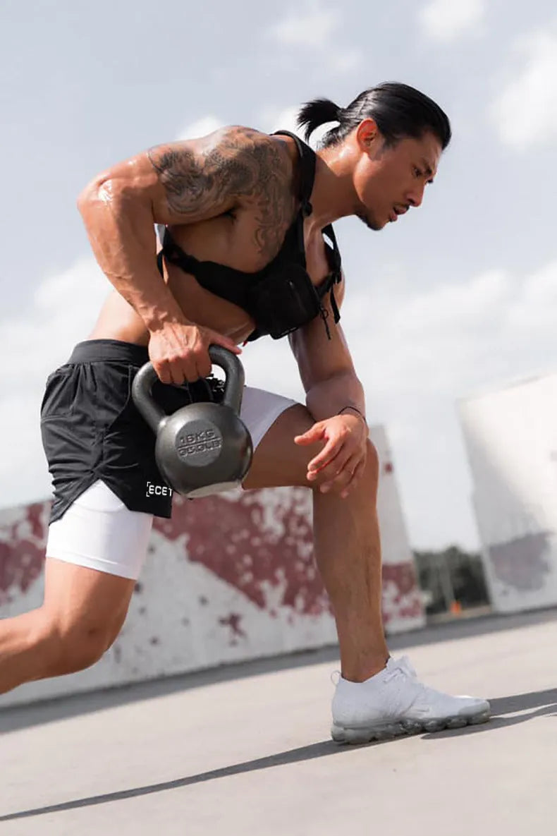 Men's quick-drying double-layer fitness shorts in Army Green with loose fit and moisture-wicking polyester fabric