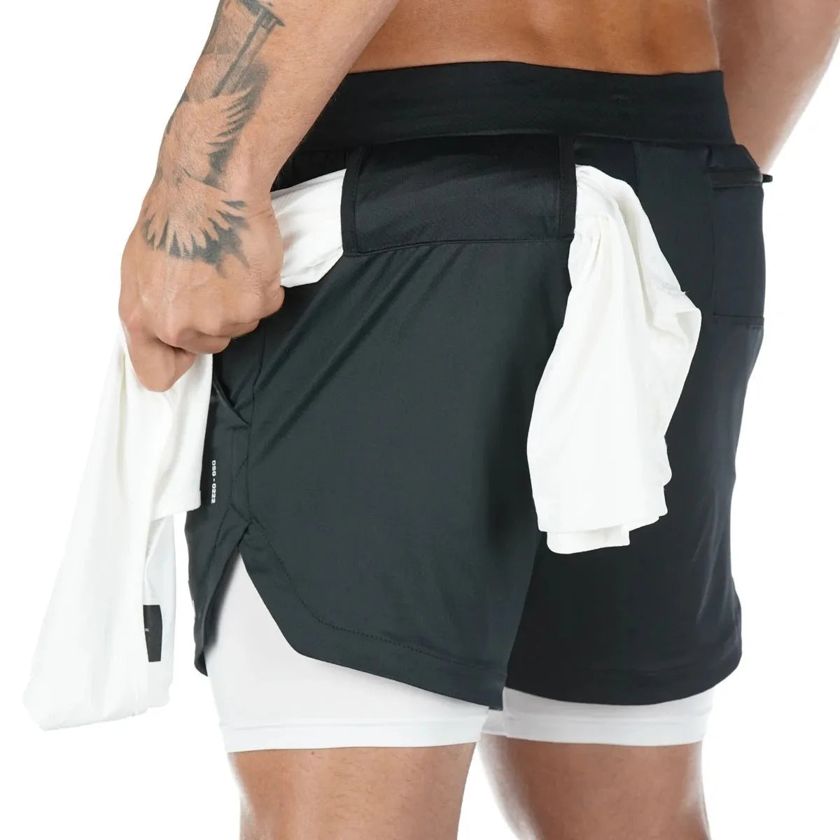 Men's quick-drying double-layer fitness shorts in Army Green with loose fit and moisture-wicking polyester fabric