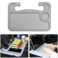 Multifunctional car desk in grey ABS with full suspension structure mounted on a car steering wheel, showing the adjustable angle handle