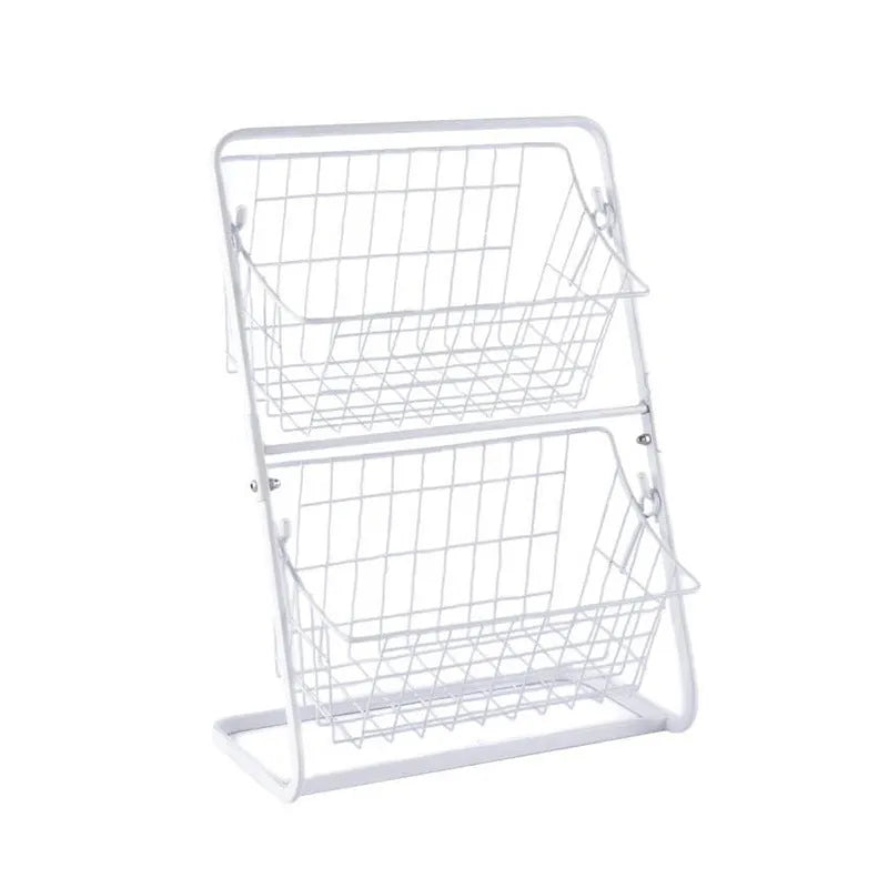 Two-tier black stainless steel kitchen storage rack with fruit and vegetables on a countertop