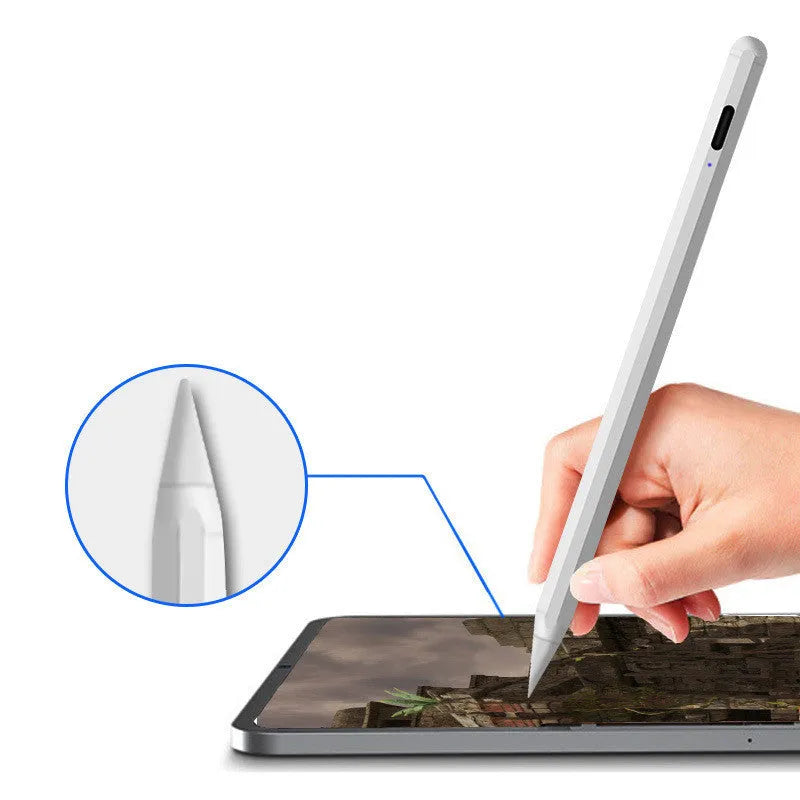 White magnetic stylus pen attached to iPad edge for digital writing and drawing