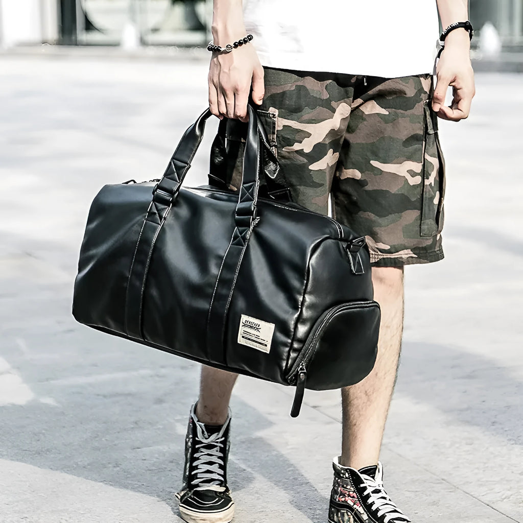 Large black waterproof PU leather sports training bag with zipper showing side view and multiple pockets