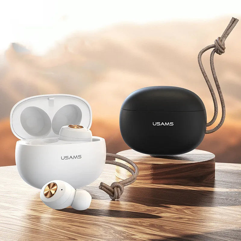 White Pebble Series Wireless Bluetooth TWS earbuds next to their compact charging case