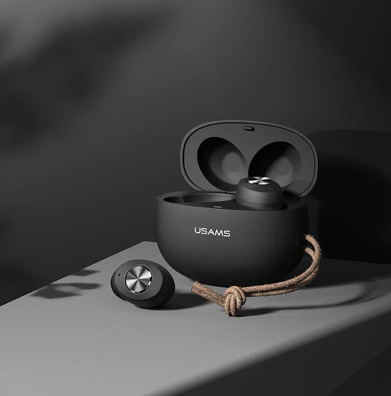 White Pebble Series Wireless Bluetooth TWS earbuds next to their compact charging case