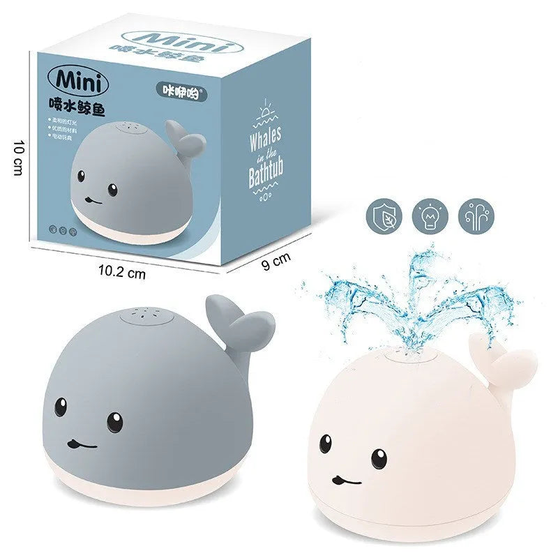 Grey or white whale bath toy floating in water with LED lights and water spray fountain