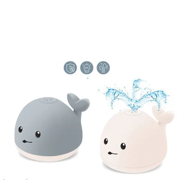 Grey or white whale bath toy floating in water with LED lights and water spray fountain