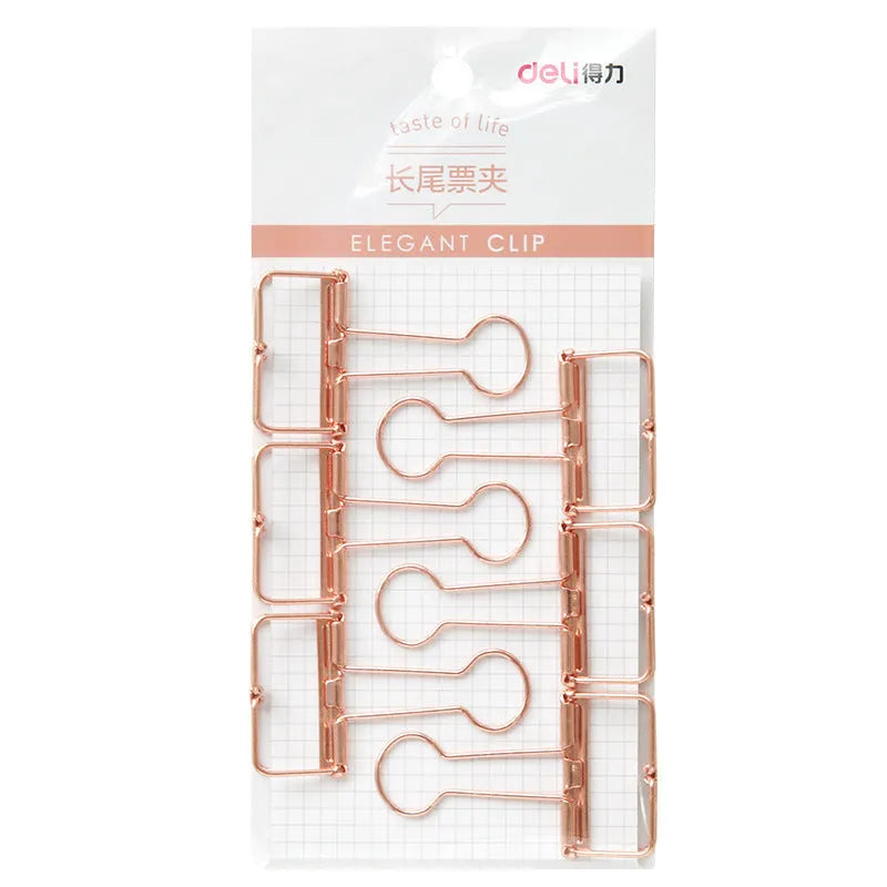 Rose gold metal ring binder set with small and large folders for documents on a desk