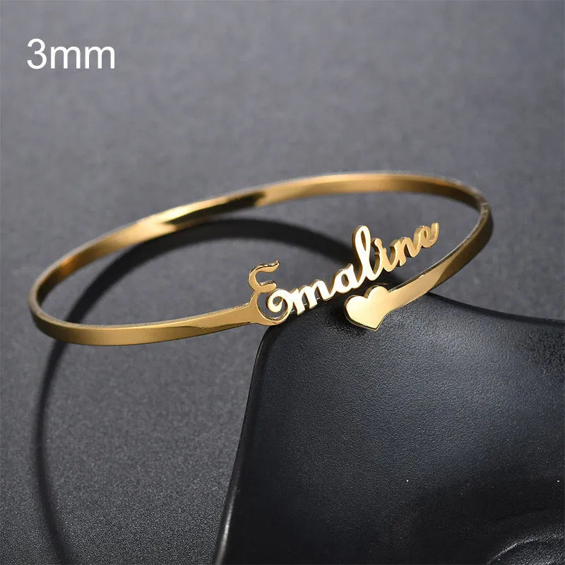 Customised name bracelet in stainless steel with silver finish and 10mm width on display