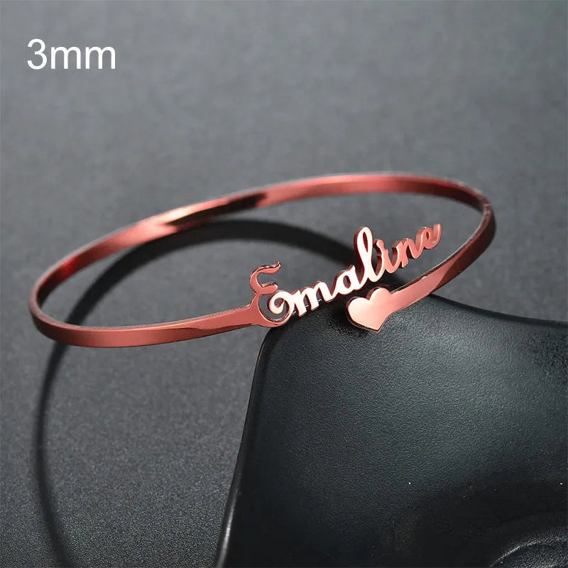 Customised name bracelet in stainless steel with silver finish and 10mm width on display