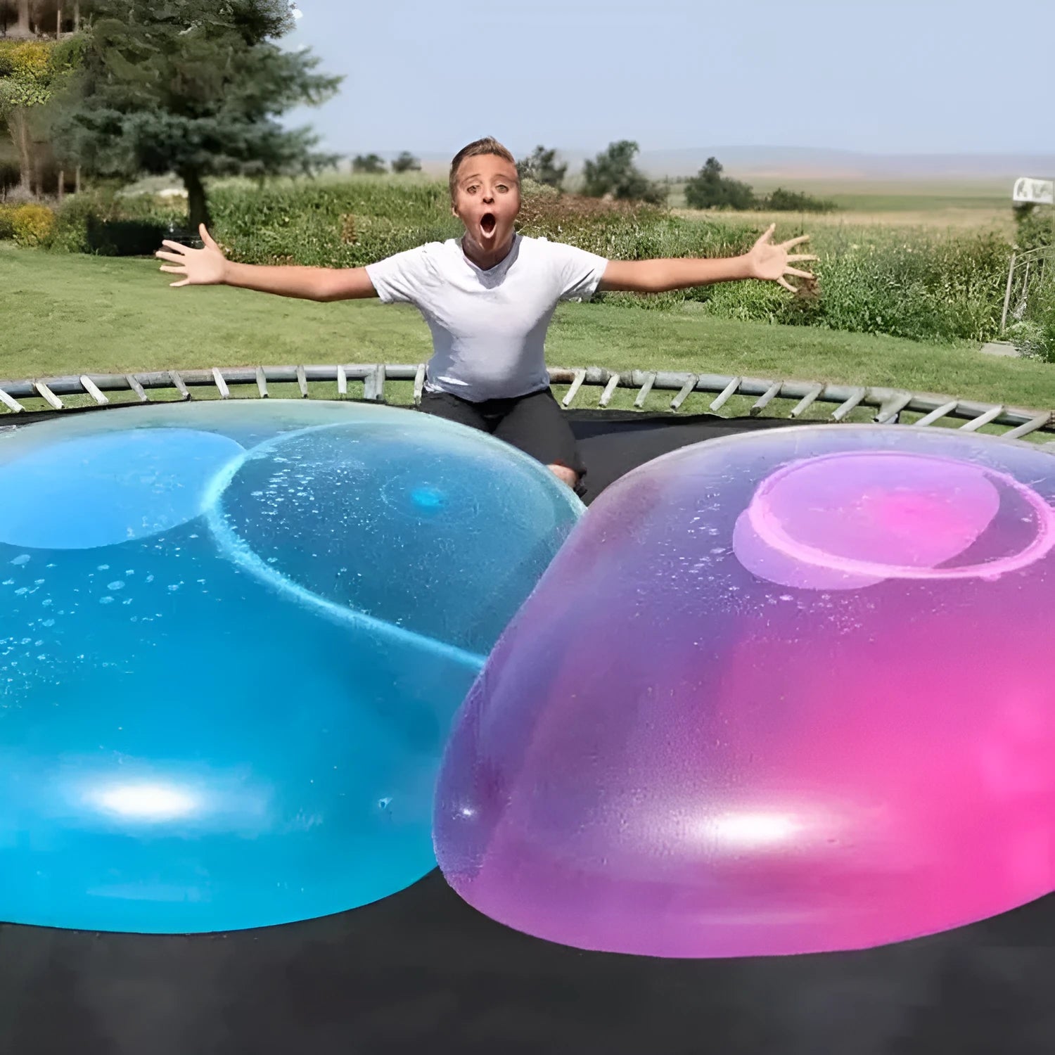 TPR inflatable ball toy in pink, yellow, green, and blue colours showing 40cm to 120cm size range