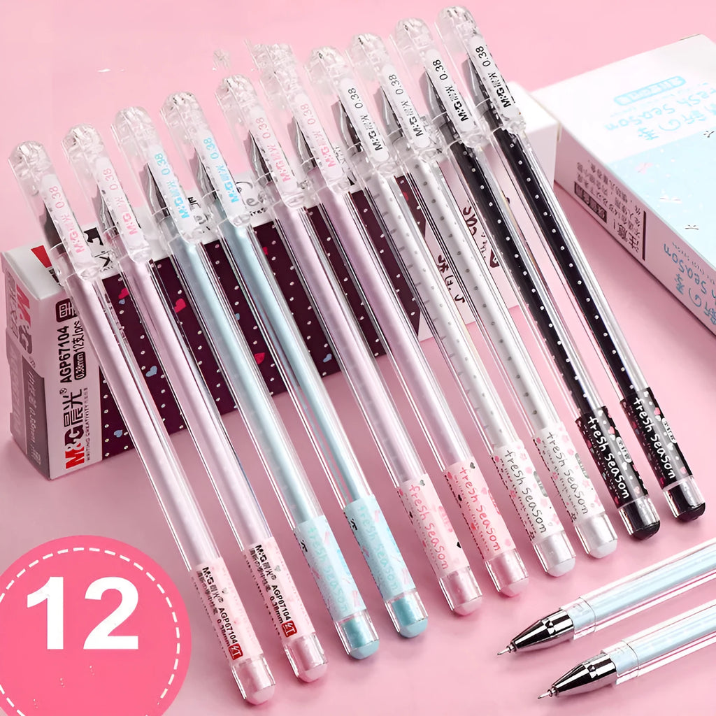 Syringe-style plastic pens with cartoon design in black, blue, and pink, shown in a 6-pen boxed set.