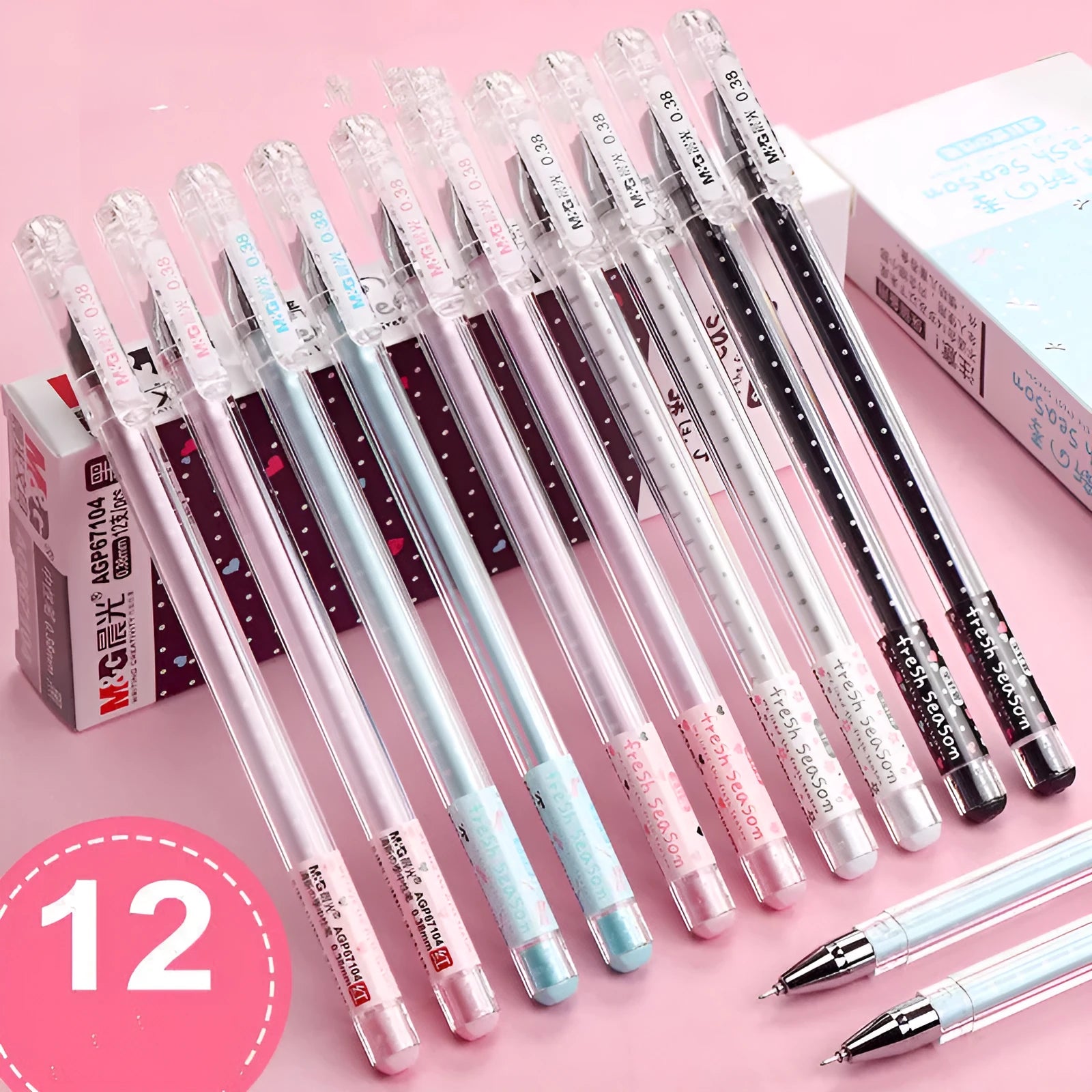 Syringe-style plastic pens with cartoon design in black, blue, and pink, shown in a 6-pen boxed set.